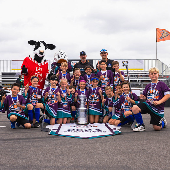 Street hockey team poses with 1st place trophy