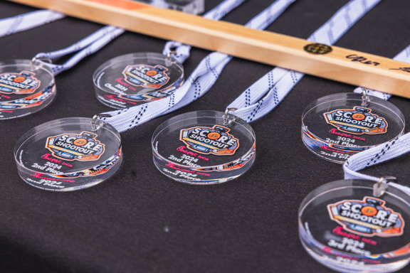 SCORE Shootout medals made from game used glass