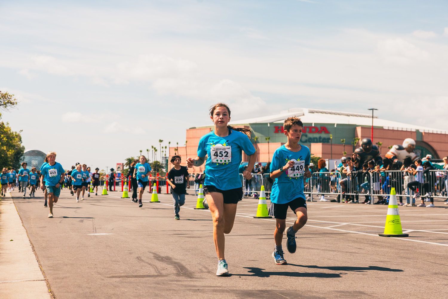 Students running a mile in front of Honda Center